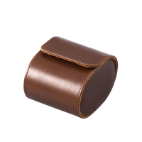 Leather watch travel case, open with padded slots visible